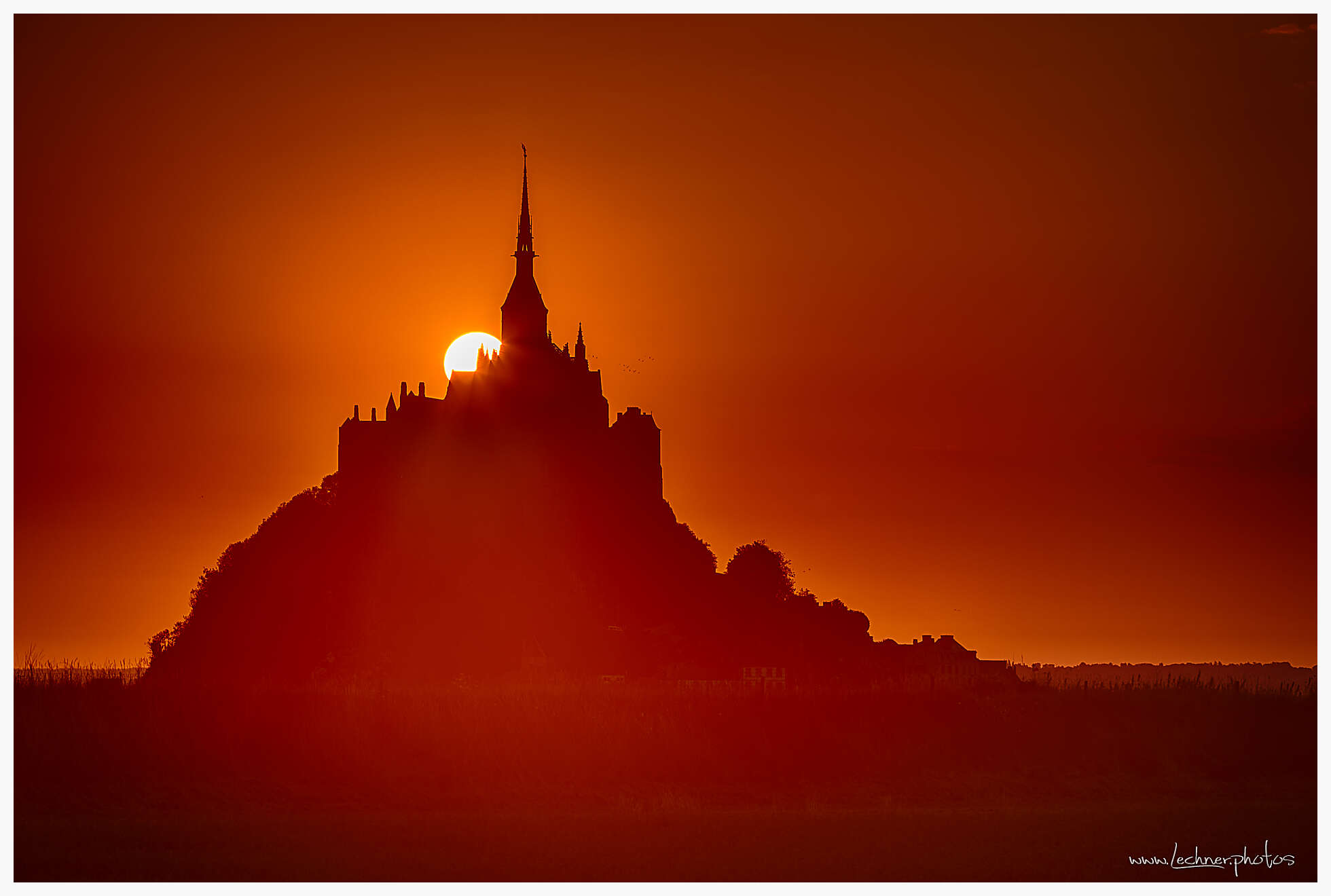 Sun rising over Mont Saint Michael